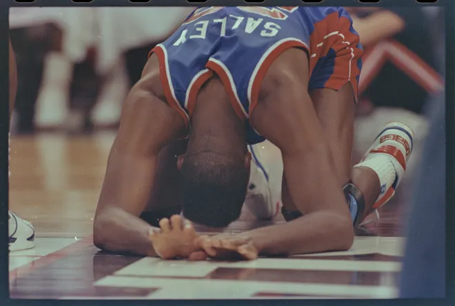 Pistons'' John Salley down on the court during game three of the 1990 NBA Finals.