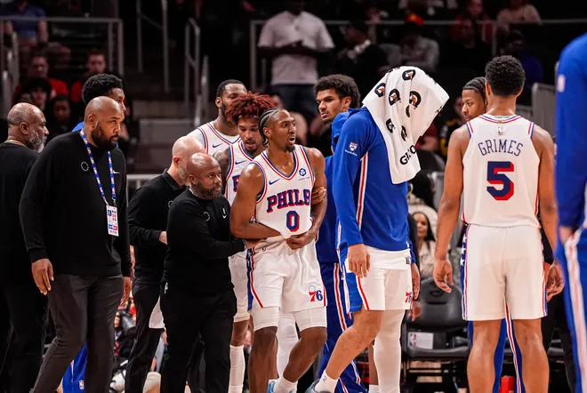 Mar 7, 2026; Atlanta, Georgia, USA; Philadelphia 76ers guard Tyrese Maxey (0) reacts and is assisted after being injured against the Atlanta Hawks during the second half at State Farm Arena. Mandatory Credit: Dale Zanine-Imagn Images