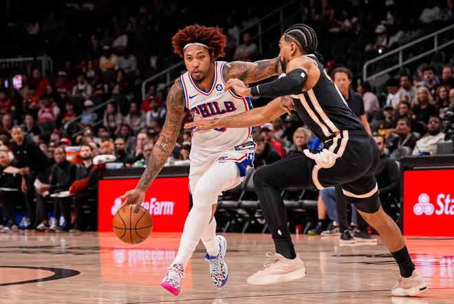 Mar 7, 2026; Atlanta, Georgia, USA; Philadelphia 76ers forward/guard Kelly Oubre Jr. (9) dribbles against Atlanta Hawks guard Gabe Vincent (4) during the first half at State Farm Arena. Mandatory Credit: Dale Zanine-Imagn Images