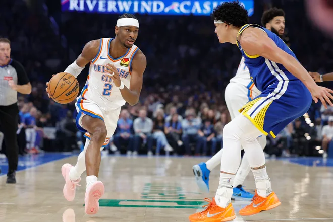 Mar 7, 2026; Oklahoma City, Oklahoma, USA; Oklahoma City Thunder guard Shai Gilgeous-Alexander (2) dribbles the ball down the court beside Golden State Warriors forward Gui Santos (15) during the first half at Paycom Center. Mandatory Credit: Alonzo Adams-Imagn Images