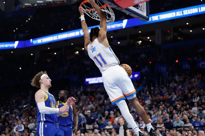 Mar 7, 2026; Oklahoma City, Oklahoma, USA; Oklahoma City Thunder guard Isaiah Joe (11) dunks against the Golden State Warriors during the first half at Paycom Center. Mandatory Credit: Alonzo Adams-Imagn Images