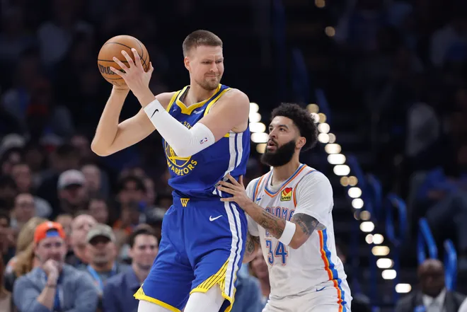 Mar 7, 2026; Oklahoma City, Oklahoma, USA; Golden State Warriors forward/center Kristaps Porziņģis (7) moves the ball against Oklahoma City Thunder guard/forward Kenrich Williams (34) during the first half at Paycom Center. Mandatory Credit: Alonzo Adams-Imagn Images