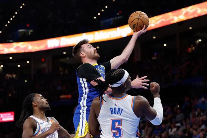 Mar 7, 2026; Oklahoma City, Oklahoma, USA; Golden State Warriors guard Pat Spencer (61) shoots over Oklahoma City Thunder forward Jaylin Williams (6) during the second half at Paycom Center. Mandatory Credit: Alonzo Adams-Imagn Images