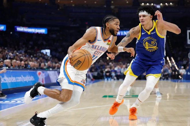 Mar 7, 2026; Oklahoma City, Oklahoma, USA; Oklahoma City Thunder guard Isaiah Joe (11) drives past Golden State Warriors forward Gui Santos (15) during the first half at Paycom Center. Mandatory Credit: Alonzo Adams-Imagn Images