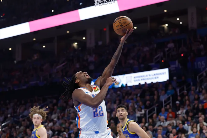 Mar 7, 2026; Oklahoma City, Oklahoma, USA; Oklahoma City Thunder guard Cason Wallace (22) goes to the basket against the Golden State Warriors during the first half at Paycom Center. Mandatory Credit: Alonzo Adams-Imagn Images