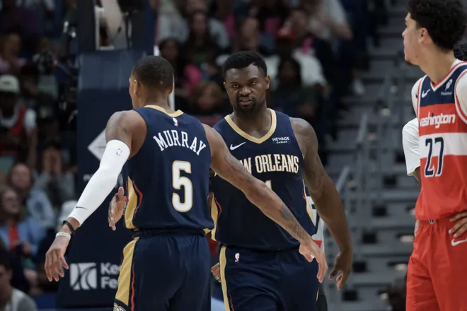 Mar 8, 2026; New Orleans, Louisiana, USA; New Orleans Pelicans forward Zion Williamson (1) reacts to a basket with guard Dejounte Murray (5) against the Washington Wizards during the first half at Smoothie King Center. Mandatory Credit: Matthew Hinton-Imagn Images