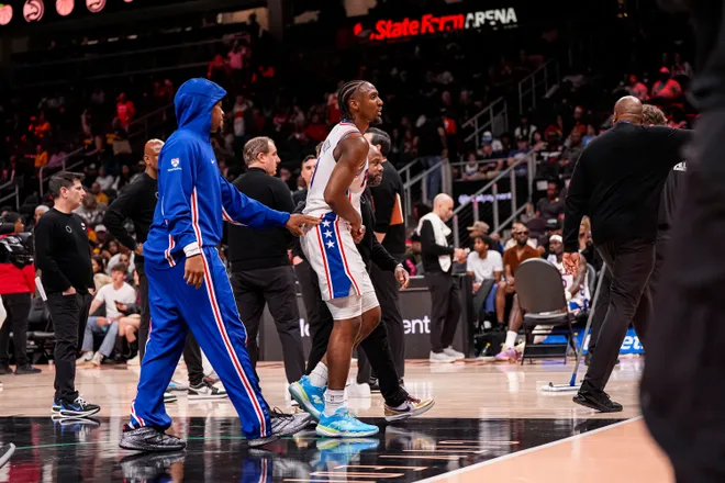 Mar 7, 2026; Atlanta, Georgia, USA; Philadelphia 76ers guard Tyrese Maxey (0) reacts and is assisted after being injured against the Atlanta Hawks during the second half at State Farm Arena. Mandatory Credit: Dale Zanine-Imagn Images