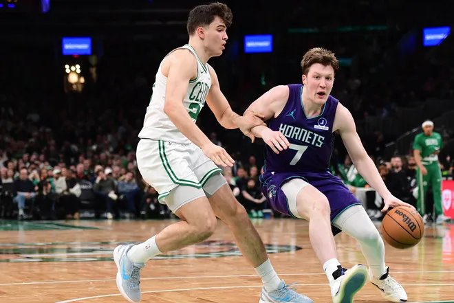 Mar 4, 2026; Boston, Massachusetts, USA; Charlotte Hornets guard Kon Knueppel (7) controls the ball while Boston Celtics guard Hugo Gonzalez (28) defends during the second half at TD Garden. Mandatory Credit: Bob DeChiara-Imagn Images