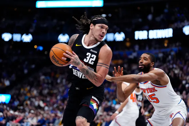 Mar 6, 2026; Denver, Colorado, USA; Denver Nuggets forward Aaron Gordon (32) and New York Knicks guard Mikal Bridges (25) during the second quarter at Ball Arena. Mandatory Credit: Ron Chenoy-Imagn Images