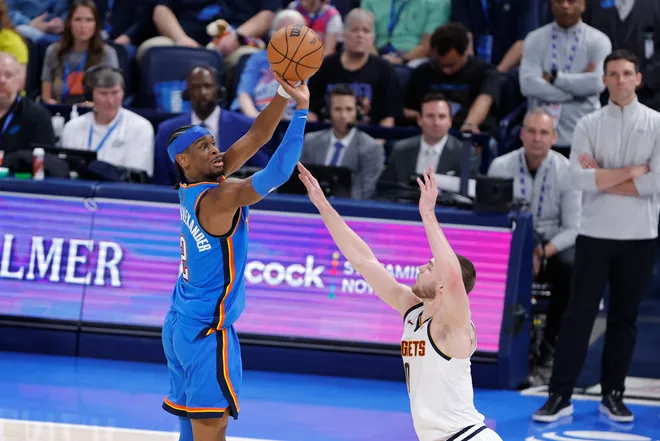 Mar 9, 2026; Oklahoma City, Oklahoma, USA; Oklahoma City Thunder guard Shai Gilgeous-Alexander (2) shoots over Denver Nuggets guard Christian Braun (0) during the second half at Paycom Center. Mandatory Credit: Alonzo Adams-Imagn Images