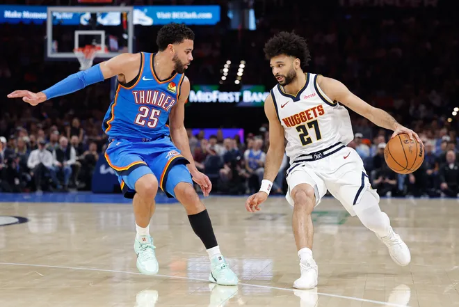 Mar 9, 2026; Oklahoma City, Oklahoma, USA; Denver Nuggets guard Jamal Murray (27) moves the ball down the court beside Oklahoma City Thunder guard Ajay Mitchell (25) during the second quarter at Paycom Center. Mandatory Credit: Alonzo Adams-Imagn Images