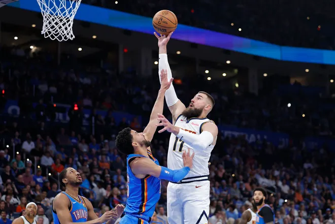 Mar 9, 2026; Oklahoma City, Oklahoma, USA; Denver Nuggets center Jonas Valančiūnas (17) shoots over Oklahoma City Thunder guard Ajay Mitchell (25) during the second quarter at Paycom Center. Mandatory Credit: Alonzo Adams-Imagn Images