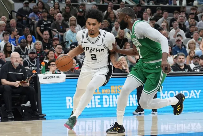 Mar 10, 2026; San Antonio, Texas, USA; San Antonio Spurs guard Dylan Harper (2) drives to the basket against Boston Celtics guard Jaylen Brown (7) in the first half at Frost Bank Center.