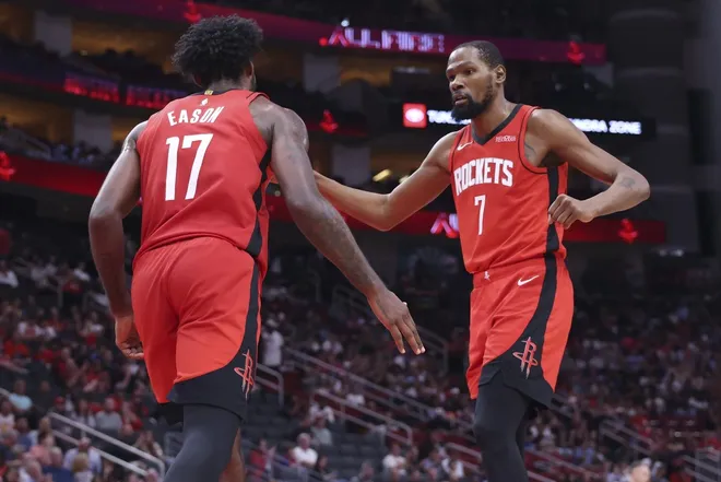Mar 10, 2026; Houston, Texas, USA; Houston Rockets forward Tari Eason (17) celebrates with forward Kevin Durant (7) after scoring a basket during the fourth quarter against the Toronto Raptors at Toyota Center.