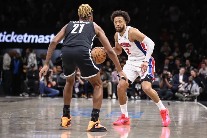 Mar 10, 2026; Brooklyn, New York, USA; Detroit Pistons guard Cade Cunningham (2) looks to drive past Brooklyn Nets forward Noah Clowney (21) in the third quarter at Barclays Center.