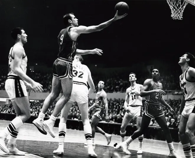 St. Louis Hawks forward Bob Pettit lays the ball in against the Los Angeles Lakers during game 6 of the 1961 Western Division championship.