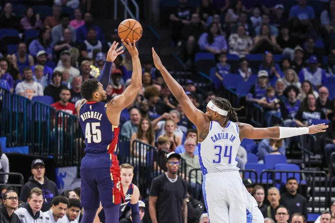 Cleveland Cavaliers guard Donovan Mitchell shoots against Orlando Magic's Wendell Carter Jr.