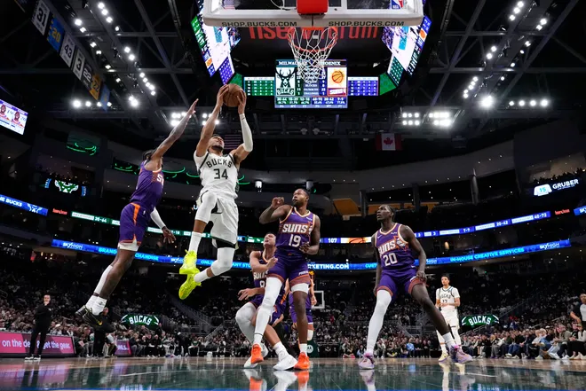 Milwaukee Bucks forward Giannis Antetokounmpo shoots during the fourth quarter against the Phoenix Suns at Fiserv Forum.