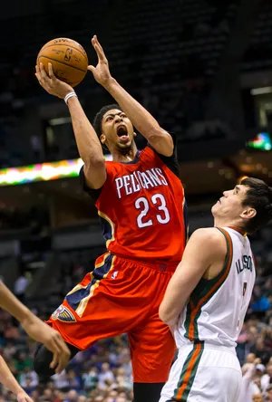 New Orleans Pelicans forward Anthony Davis shoots over Milwaukee Bucks forward Ersan Ilyasova.