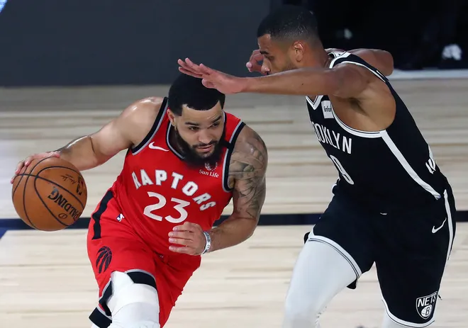 Fred VanVleet #23 of the Toronto Raptors moves the ball against Timothe Luwawu-Cabarrot #9 of the Brooklyn Nets
