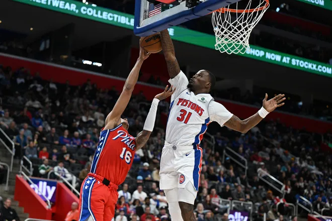 Mar 12, 2026; Detroit, Michigan, USA; Detroit Pistons guard Javonte Green (31) blocks a shot by Philadelphia 76ers forward Marjon Beauchamp (16) in the second half at Little Caesars Arena. Mandatory Credit: Lon Horwedel-Imagn Images