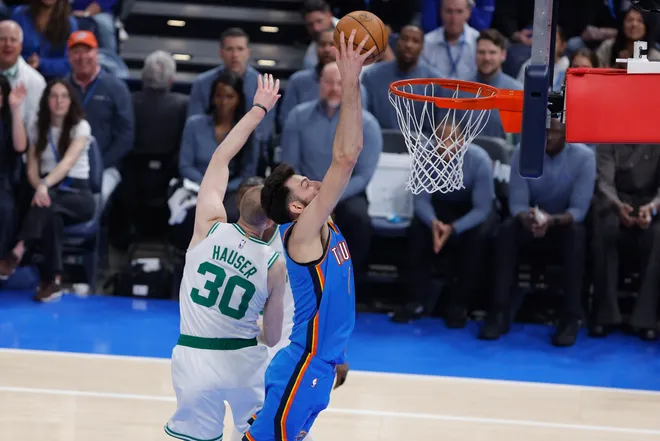 Mar 12, 2026; Oklahoma City, Oklahoma, USA; Oklahoma City Thunder center/forward Chet Holmgren (7) goes up for a dunk beside Boston Celtics forward Sam Hauser (30) during the first quarter at Paycom Center. Mandatory Credit: Alonzo Adams-Imagn Images