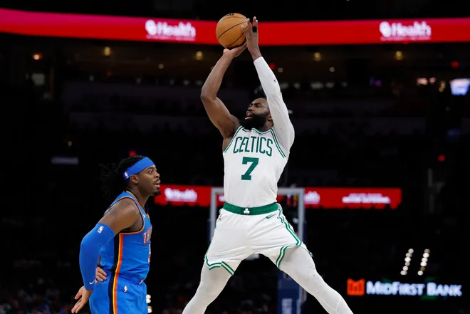 Mar 12, 2026; Oklahoma City, Oklahoma, USA; Boston Celtics guard/forward Jaylen Brown (7) shoots over Oklahoma City Thunder guard Luguentz Dort (5) during the fourth quarter at Paycom Center. Mandatory Credit: Alonzo Adams-Imagn Images