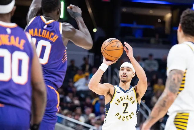 Mar 12, 2026; Indianapolis, Indiana, USA; Indiana Pacers guard/forward Andrew Nembhard (2) shoots the ball while Phoenix Suns center Khaman Maluach (10) defends in the first half at Gainbridge Fieldhouse.