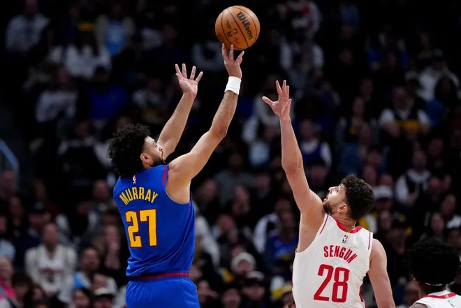 Mar 11, 2026; Denver, Colorado, USA; Houston Rockets center Alperen Sengun (28) shoots the ball over Houston Rockets center Alperen Sengun (28) in the first quarter at Ball Arena.