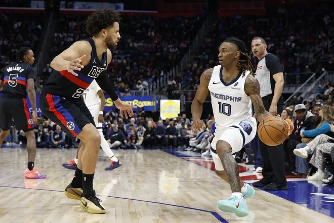 Mar 13, 2026; Detroit, Michigan, USA; Memphis Grizzlies guard Javon Small (10) dribbles defended by Detroit Pistons guard Cade Cunningham (2) in the second half at Little Caesars Arena.