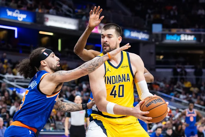 Mar 13, 2026; Indianapolis, Indiana, USA; Indiana Pacers center Ivica Zubac (40) shoots the ball while New York Knicks guard Jose Alvarado (5) defends in the first half at Gainbridge Fieldhouse. Mandatory Credit: Trevor Ruszkowski-Imagn Images