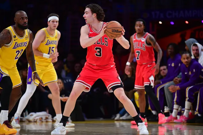 Mar 12, 2026; Los Angeles, California, USA; Chicago Bulls guard Josh Giddey (3) controls the ball against Los Angeles Lakers forward LeBron James (23) during the first half at Crypto.com Arena. Mandatory Credit: Gary A. Vasquez-Imagn Images