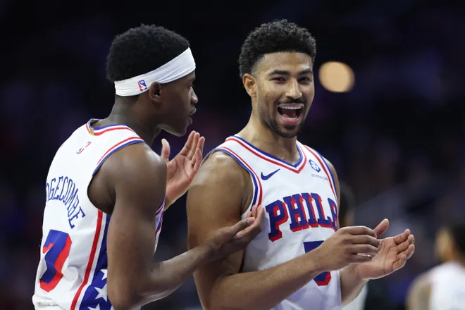 Mar 14, 2026; Philadelphia, Pennsylvania, USA; Philadelphia 76ers guard Quentin Grimes (5) reacts with guard Vj Edgecombe (77) during the fourth quarter against the Brooklyn Nets at Xfinity Mobile Arena. Mandatory Credit: Bill Streicher-Imagn Images