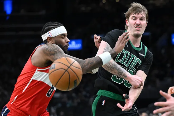 Mar 14, 2026; Boston, Massachusetts, USA; Boston Celtics guard Baylor Scheierman (55) passes the ball against the Washington Wizards during the second half at the TD Garden. Mandatory Credit: Brian Fluharty-Imagn Images