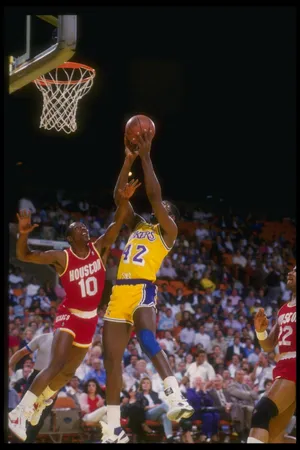 1987: Dirk Minniefield of the Los Angeles Lakers goes up for two during a game against the Houston Rockets at the Great Western Forum in Inglewood, California. Mandatory Credit: Mike Powell /Allsport Mandatory Credit: Mike Powell /Allsport