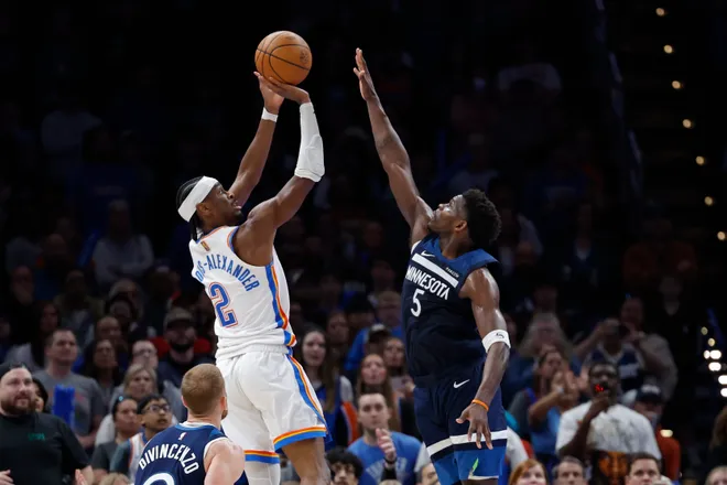 Mar 15, 2026; Oklahoma City, Oklahoma, USA; Oklahoma City Thunder guard Shai Gilgeous-Alexander (2) shoots over Minnesota Timberwolves guard Anthony Edwards (5) during the second half at Paycom Center. Mandatory Credit: Alonzo Adams-Imagn Images