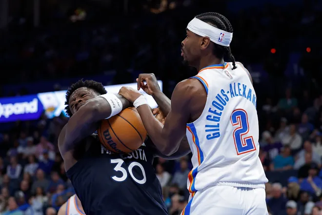 Mar 15, 2026; Oklahoma City, Oklahoma, USA; Minnesota Timberwolves forward/center Julius Randle (30) and Oklahoma City Thunder guard Shai Gilgeous-Alexander (2) fight for a loose ball during the second half at Paycom Center. Mandatory Credit: Alonzo Adams-Imagn Images