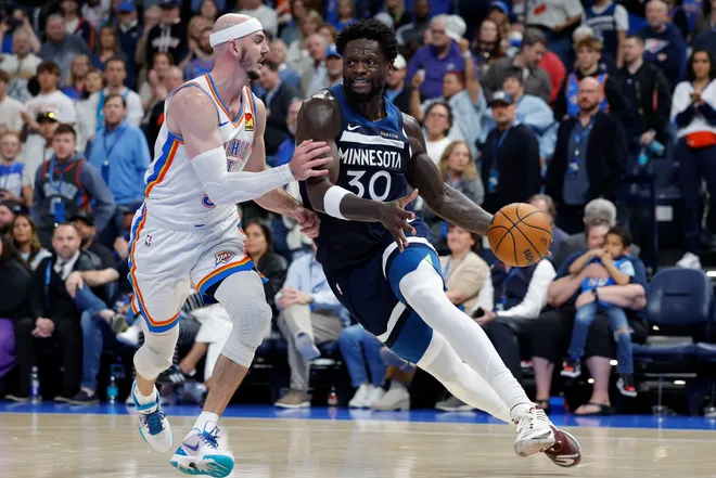 Mar 15, 2026; Oklahoma City, Oklahoma, USA; Minnesota Timberwolves forward/center Julius Randle (30) drives around Oklahoma City Thunder guard Alex Caruso (9) during the second half at Paycom Center. Mandatory Credit: Alonzo Adams-Imagn Images