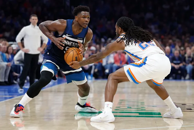 Mar 15, 2026; Oklahoma City, Oklahoma, USA; Oklahoma City Thunder guard Cason Wallace (22) steals the ball away from Minnesota Timberwolves guard Anthony Edwards (5) during the second half at Paycom Center. Mandatory Credit: Alonzo Adams-Imagn Images