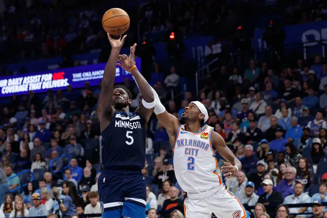 Mar 15, 2026; Oklahoma City, Oklahoma, USA; Minnesota Timberwolves guard Anthony Edwards (5) shoots beside Oklahoma City Thunder guard Shai Gilgeous-Alexander (2) during the second half at Paycom Center. Mandatory Credit: Alonzo Adams-Imagn Images
