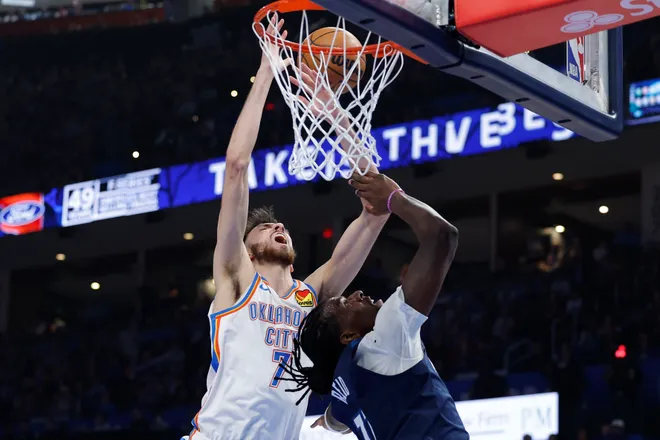 Mar 15, 2026; Oklahoma City, Oklahoma, USA; Oklahoma City Thunder center/forward Chet Holmgren (7) is fouled by Minnesota Timberwolves center/forward Naz Reid (11) on the way to the basket during the first half at Paycom Center. Mandatory Credit: Alonzo Adams-Imagn Images