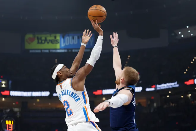 Mar 15, 2026; Oklahoma City, Oklahoma, USA; Oklahoma City Thunder guard Shai Gilgeous-Alexander (2) shoots over Minnesota Timberwolves guard Donte DiVincenzo (0) defends the shot during the first half at Paycom Center. Mandatory Credit: Alonzo Adams-Imagn Images