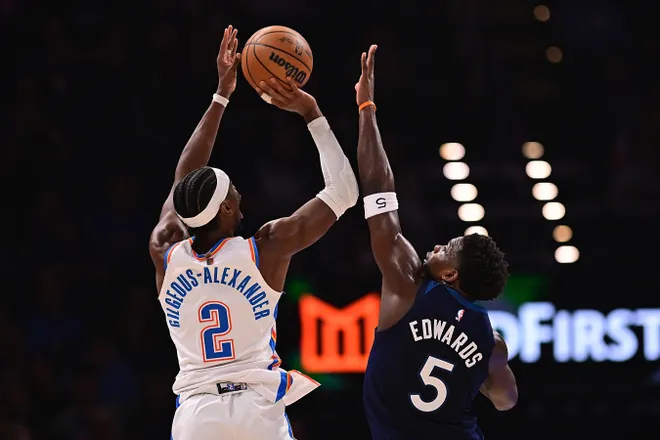 OKLAHOMA CITY, OKLAHOMA - MARCH 15: Shai Gilgeous-Alexander #2 of the Oklahoma City Thunder attempts a shot in front of Anthony Edwards #5 of the Minnesota Timberwolves at Paycom Center on March 15, 2026 in Oklahoma City, Oklahoma. NOTE TO USER: User expressly acknowledges and agrees that, by downloading and or using this photograph, User is consenting to the terms and conditions of the Getty Images License Agreement. (Photo by Joshua Gateley/Getty Images)