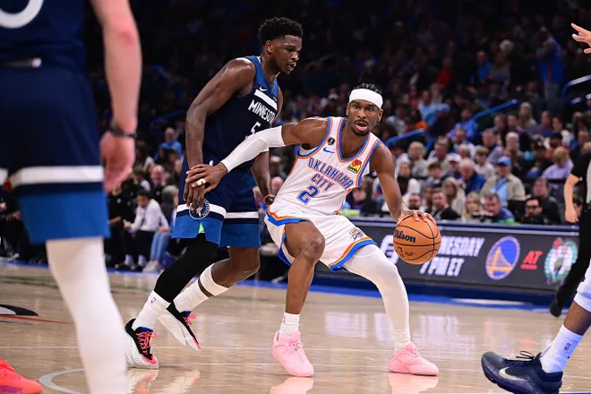 OKLAHOMA CITY, OKLAHOMA - MARCH 15: Shai Gilgeous-Alexander #2 of the Oklahoma City Thunder handles the ball in front of Anthony Edwards #5 of the Minnesota Timberwolves during the second half at Paycom Center on March 15, 2026 in Oklahoma City, Oklahoma. NOTE TO USER: User expressly acknowledges and agrees that, by downloading and or using this photograph, User is consenting to the terms and conditions of the Getty Images License Agreement. (Photo by Joshua Gateley/Getty Images)