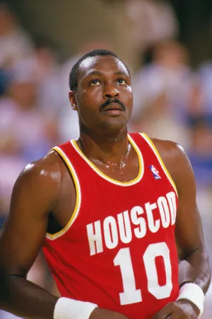 1986: Purvis Short #10 of the Houston Rockets looks on during a game in the 1986-87 season. NOTE TO USER: User expressly acknowledges and agrees that, by downloading and/or using this Photograph, User is consenting to the terms and conditions of the Getty Images License Agreement. (Photo by: Rick Stewart/Getty Images)