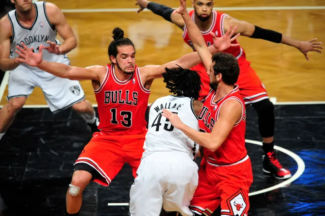 May 4, 2013; Brooklyn, NY, USA; Brooklyn Nets small forward Gerald Wallace (45) makes a move around Chicago Bulls defenders during the first half in game seven of the first round of the 2013 NBA Playoffs at the Barclays Center. Mandatory Credit: Joe Camporeale-USA TODAY Sports