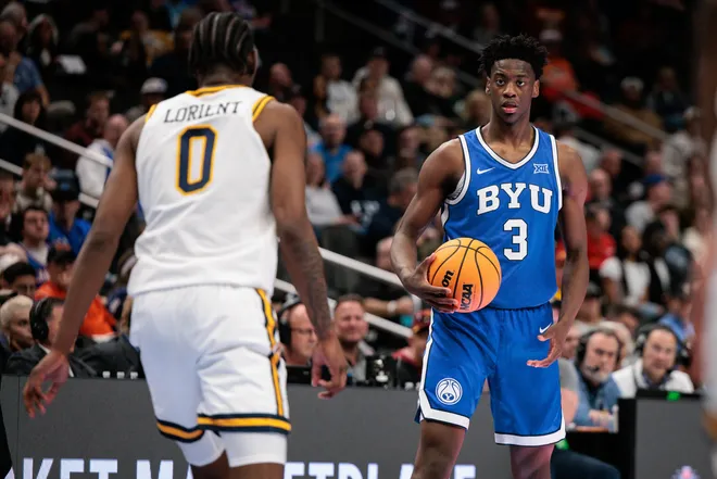 Mar 11, 2026; Kansas City, MO, USA; BYU Cougars forward AJ Dybantsa (3) sets the play in front of West Virginia Mountaineers forward Brenen Lorient (0) during the second half at T-Mobile Center. Mandatory Credit: William Purnell-Imagn Images