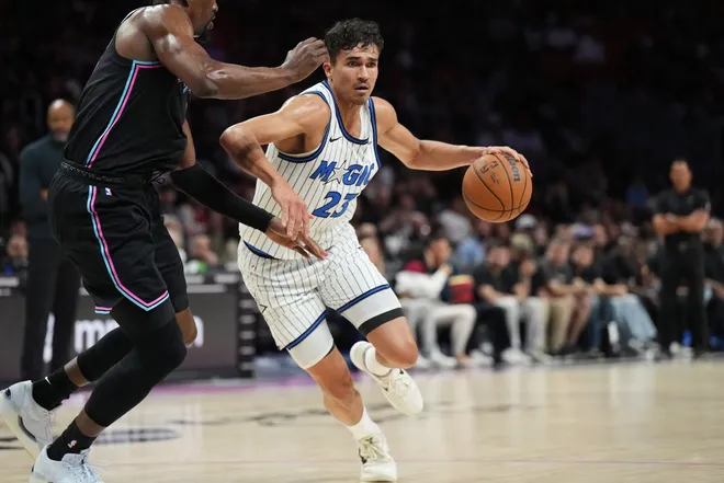 Mar 14, 2026; Miami, Florida, USA; Orlando Magic forward Tristan da Silva (23) drives to the basket as Miami Heat center Bam Adebayo (13) defends during the first half at Kaseya Center.
