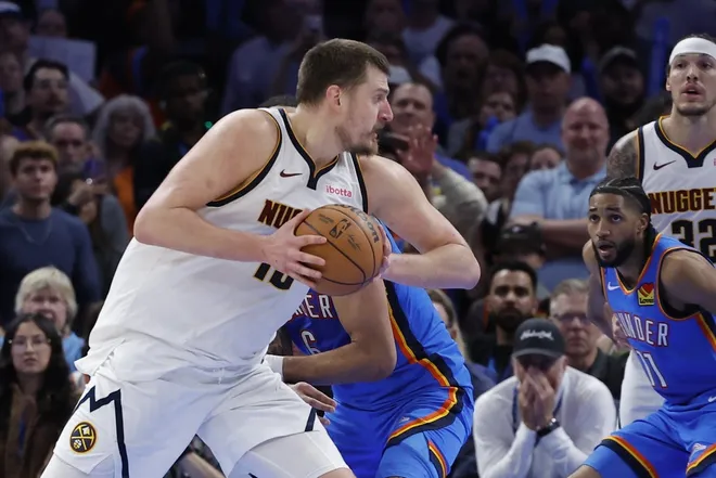 Mar 9, 2026; Oklahoma City, Oklahoma, USA; Denver Nuggets center Nikola Jokić (15) drives to the basket against the Oklahoma City Thunder during the second half at Paycom Center.