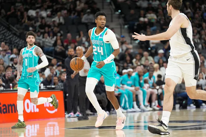 Mar 14, 2026; San Antonio, Texas, USA; Charlotte Hornets forward Brandon Miller (24) dribbles in front of San Antonio Spurs center Luke Kornet (7) in the first half at Frost Bank Center. Mandatory Credit: Daniel Dunn-Imagn Images